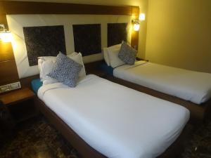 Postel nebo postele na pokoji v ubytování Hotel Sapna