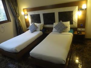 Postel nebo postele na pokoji v ubytování Hotel Sapna