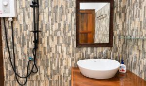 a bathroom with a bath tub and a sink at Zen Harmony Pool Villa in Ko Phangan +46 photos