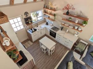 an overhead view of a kitchen with a table at Cape St Francis Beach Cottage in Cape St Francis +21 photos