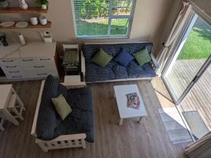an overhead view of a living room with a couch at Cape St Francis Beach Cottage in Cape St Francis