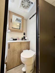 a small bathroom with a toilet and a sink at Rest Up Retreat-New Lux RV-Private-6Flags-Fire Pit-Hammock-Atlanta in Atlanta +63 photos