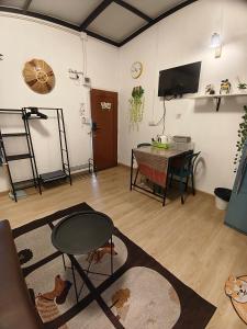 a living room with a table and a dining room at บ้านสุขสันต์ พฤกษา45 บางใหญ่ in Ban Nong Kradi +9 photos