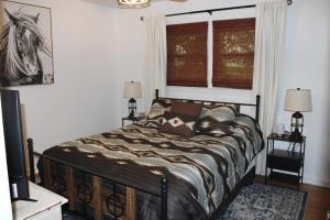 a bedroom with a bed and a window at The Audobon Escape in Aiken