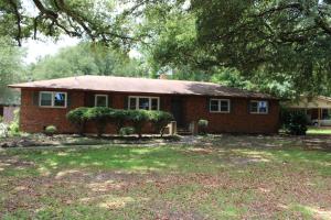 a red brick house with a tree at The Audobon Escape in Aiken