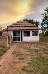 a small house in the middle of a field at Finca Zen, naturaleza y agroecologia in San Rafael