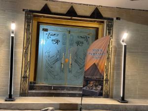 a large glass door with a sign that reads how fragile is way at Royal Pyramids Hotel in Cairo +120 photos
