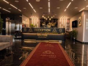 a hotel lobby with a welcome mat on the floor at Asgard Hotel in Beylikduzu