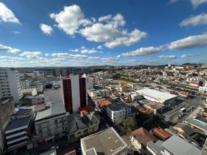 a city view of a city with buildings at Studio Blanc - Espaço e conforto com uma vista incrivel in Barbacena