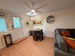 a living room with a couch and a table at Laie Temple Hale in Laie +9 photos
