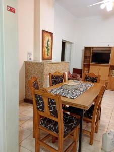 a dining room with a table and chairs at Complejo turistico ALOJARTUR in San Rafael