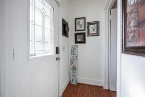 a hallway with a white door and a window at Room B2 Shared bathroom Kingbed washer dryer in Rochester