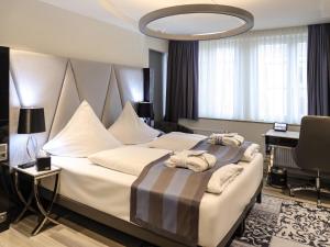 Vuode tai vuoteita majoituspaikassa Mercure Hotel Kaiserhof City Center