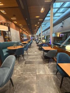 a row of tables and chairs in a restaurant at Apartmani delux in Sarajevo