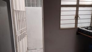 an open door to a kitchen with a window at Aparta Studio Las Palmas in La Dorada