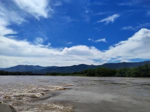 a view of a river with mountains in the background at Aparta Studio Las Palmas in La Dorada +4 photos