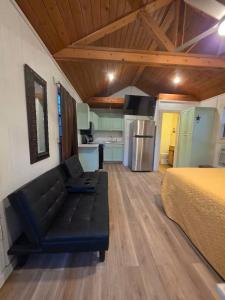a room with a bed and a kitchen at River Run Maggie's house in Kerrville