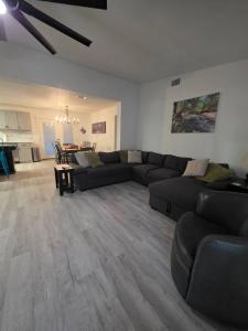 a living room with a couch and a table at River Run Retreat in Kerrville +15 photos