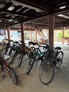 a row of bikes parked next to each other at Loy Manee House in Phra Nakhon Si Ayutthaya