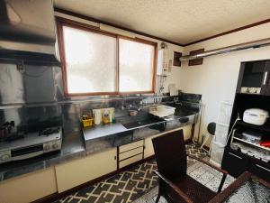 a kitchen with a sink and a window at TOTONOU Place in Asahikawa +34 photos
