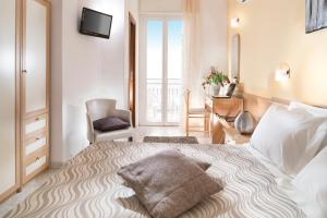 Postel nebo postele na pokoji v ubytování Hotel Bellerofonte + 34 fotografií