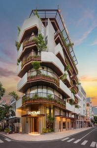 an architectural rendering of a building with balconies at XHOME Danang Hotel & Suite - Near My Khe Beach in Danang