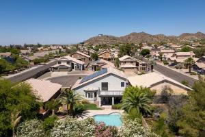 an aerial view of a house with a swimming pool at Sparkling SaltwtrPoolSpaFirepitFreeNetflixWiFi in Phoenix +57 photos