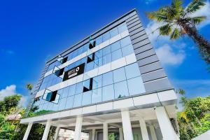 an office building with a sign on it at Super Hotel O North Kalamassery in Cochin