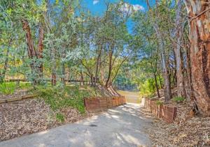 an estate with a private driveway and trees at #4 Riverspa in Moama