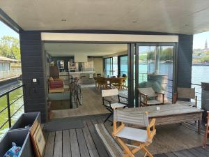 a house with a deck with a view of the water at Peniche Casa Luze in Issy-les-Moulineaux