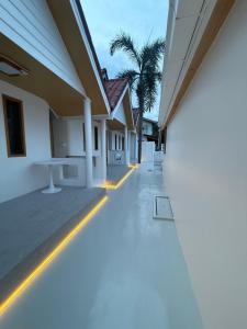 a hallway of a house with a light on the floor at Albus resort Kohlarn in Ko Larn +6 photos
