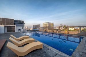 a swimming pool on the roof of a building at Oakwood Merdeka Bandung in Bandung
