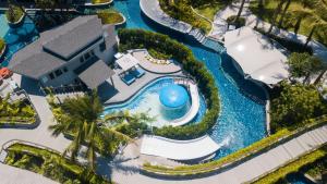 an aerial view of a resort with a swimming pool at Meliá Koh Samui in Choeng Mon Beach