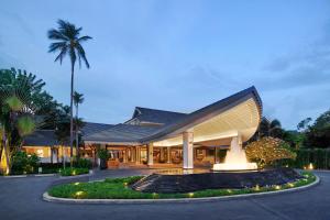 a building with a staircase in front of it at Meliá Koh Samui in Choeng Mon Beach