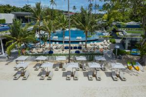 an aerial view of a resort with chairs and a pool at Meliá Koh Samui in Choeng Mon Beach +64 photos