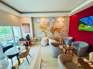 a room with a map of the world on the wall at View Talay 6 Pattaya Beach Apartment by Honey in Pattaya