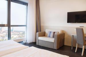 Postel nebo postele na pokoji v ubytování Viva Hotel Lübeck + 17 fotografií