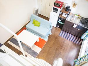 an aerial view of a living room and kitchen at 103 Cassini in Chiba