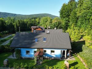 an aerial view of a house with a roof at Iskierkówka in Brenna