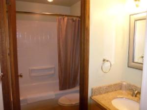 a bathroom with a shower and a sink and a toilet at Mountain View Lodge in Packwood
