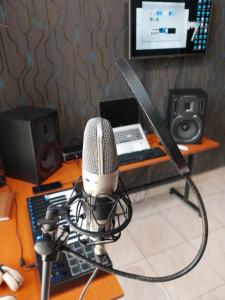 a microphone sitting on a desk next to a computer at Oundo LVHAR in Busia