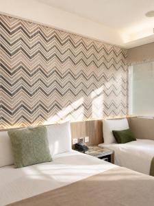 a hotel room with two beds and a couch at V-one Hotel - Ningxia No. 2 Inn in Taipei +44 photos