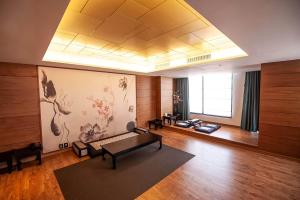a large living room with a large painting on the wall at Holiday Inn Gwangju by IHG in Gwangju