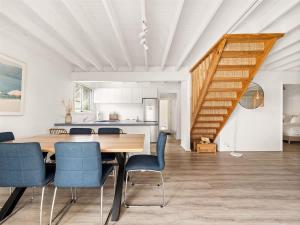 a kitchen and dining room with a table and chairs at Pepper Cottage - Easy Beachside Living Close to Town in Dunsborough