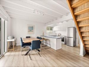 a kitchen and dining room with a table and chairs at Pepper Cottage - Easy Beachside Living Close to Town in Dunsborough +16 photos
