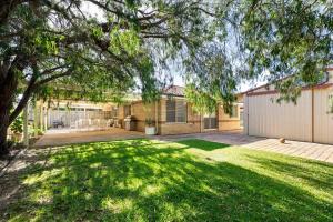 a large yard with a house and a tree at Luna Getaway in Quindalup