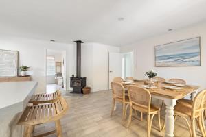 a kitchen and dining room with a table and chairs at Luna Getaway in Quindalup +13 photos