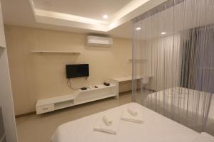 TV a/nebo společenská místnost v ubytování CA&SA Serviced Apartment