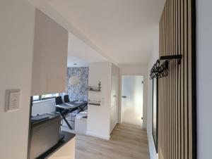 an office with a desk and a chair in a room at Main Ferienwohnung Erlabrunn in Erlabrunn