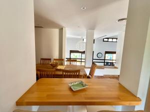 a kitchen and dining room with a table and chairs at Luna-Villa de Riviera with Sea-View in Mijas Costa